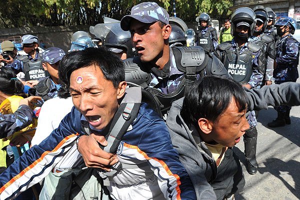 Tibetans protesting at Chinese consular in Kathmandu being handled by Nepali police in 2012. Photo by Prakash Mathema_AFP_Getty Images