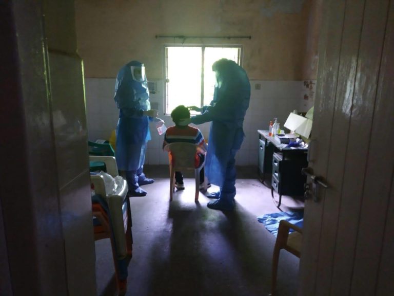 Health care workers conducting Covid-19 swab test on a Tibetan in Bylakuppe settlement (Photo courtesy tibet.net)